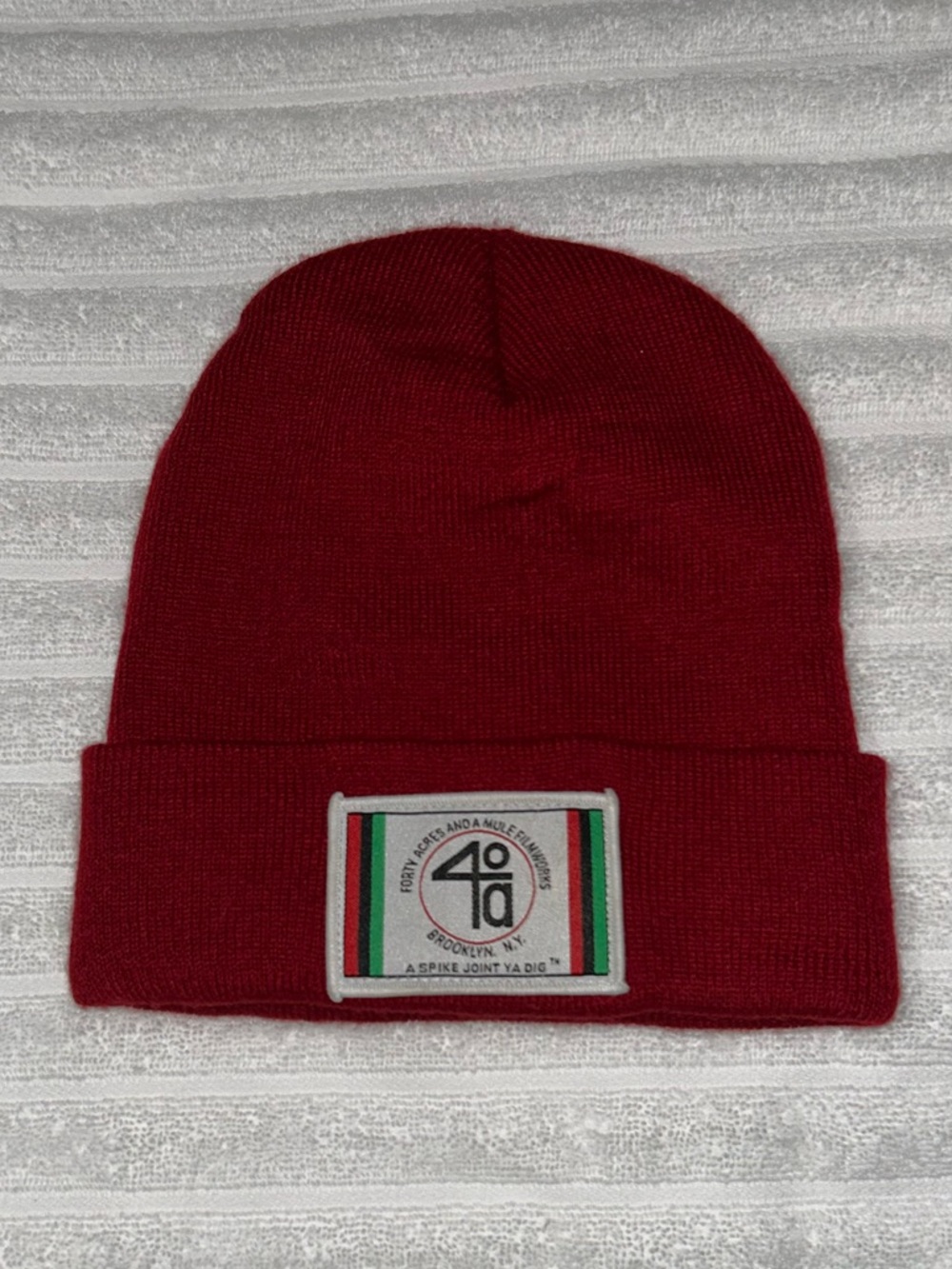 Red Knit Beanie with Green & White Logo Patch